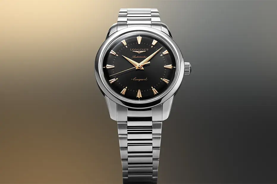 Nowoczesna interpretacja stylu retro – Longines Conquest Heritage 40 mm z czarną tarczą i różowo-złotymi akcentami na stalowej bransolecie