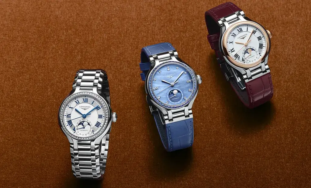 Trzy zegarki damskie Longines PrimaLuna Moonphase – na bransolecie stalowej, z niebieskim i burgundowym paskiem ze skóry aligatora