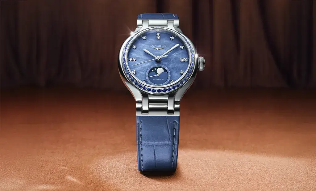 Longines PrimaLuna Moonphase z pierścieniem wysadzanym błękitnymi szafirami