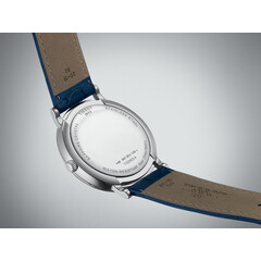Elegancki zegarek męski na niebieskim pasku skórzanym Tissot.
