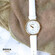 Doxa D-Trendy 145.35.058.07 zegarek dla Pań ze złoconą kopertą i białym paskiem