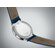 Elegancki zegarek męski na niebieskim pasku skórzanym Tissot.