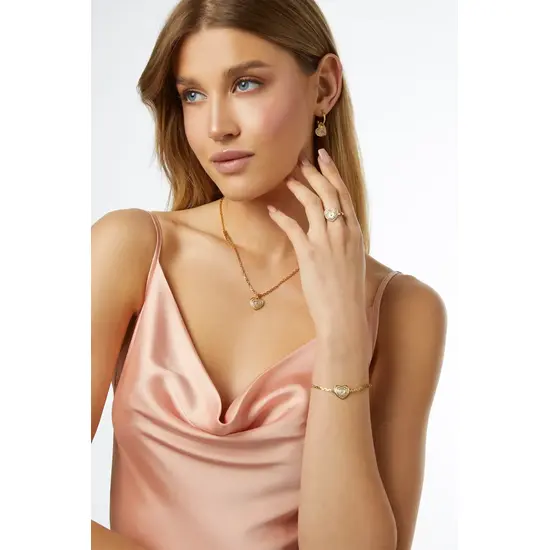 Pozłacana bransoletka z sercem, cyrkoniami i masą perłową Guess